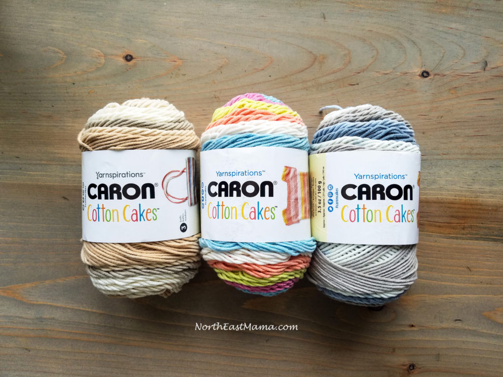 Image of 3 skein of Caron Cotton Cakes Left to Right: Garden Path, Garden Oasis, Nested Blues.