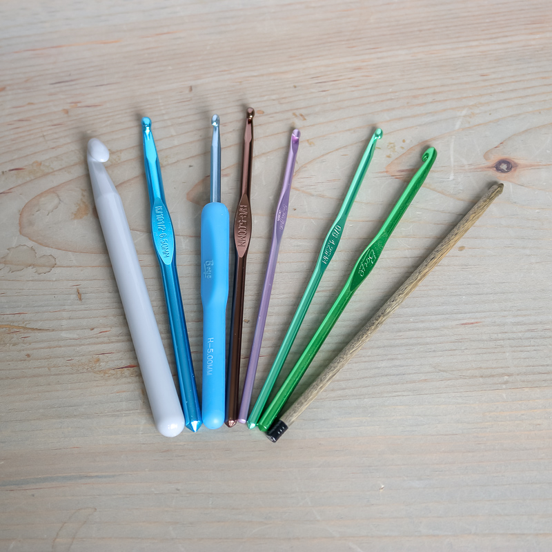 Image of 8 crochet hooks in varying sizes and materials