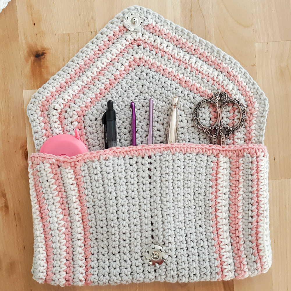 chic crochet clutch shown with crochet accessories,